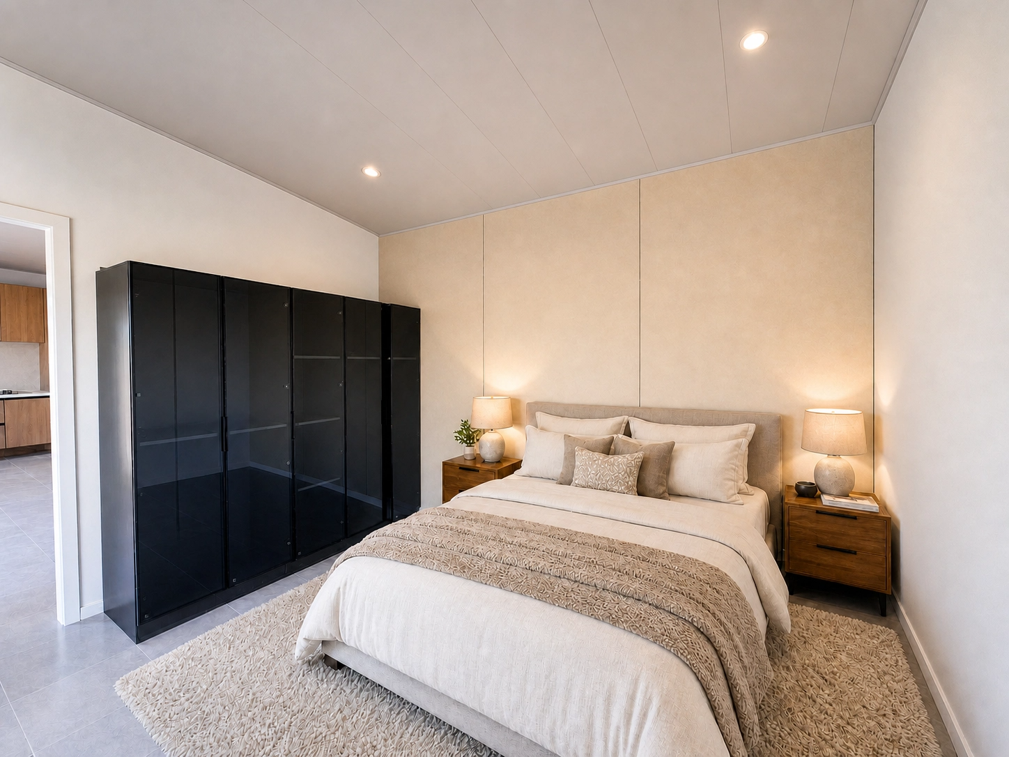 Bedroom — king bed with upholstered headboard, timber bedside tables and black wardrobe